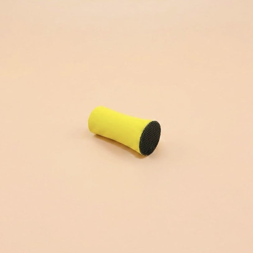 Bloc de ponçage jaune de 25 mm de diamètre, vu couché