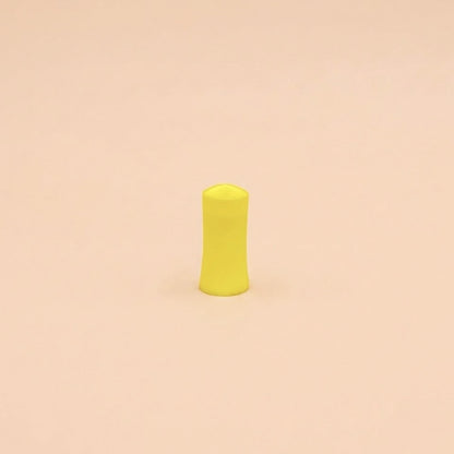 Bloc de ponçage jaune de 25 mm de diamètre, posé debout