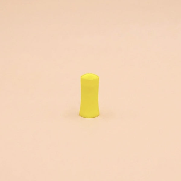 Bloc de ponçage jaune de 25 mm de diamètre, posé debout