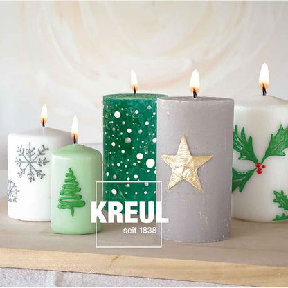 Bougies pilier décorées de sapins, flocons et étoiles avec les stylos Stylos à Bougie